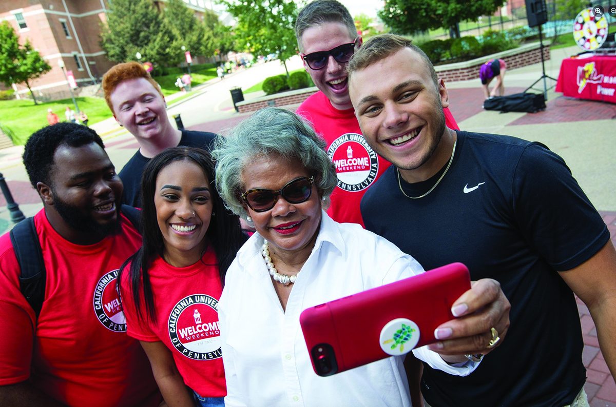 Students and a university leader take a selfie at California University of Pennsylvania Welcome Weekend Students and a university leader take a selfie at California University of Pennsylvania Welcome Weekend